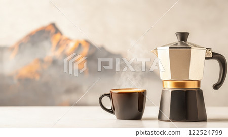 classic moka pot with steaming cup of coffee against mountain backdrop classic moka pot with steaming cup of coffee against mountain backdrop 122524799