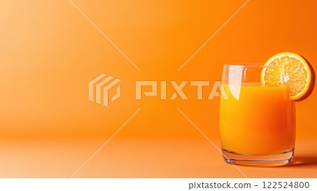 Fresh orange juice in clear glass with slice of orange 122524800