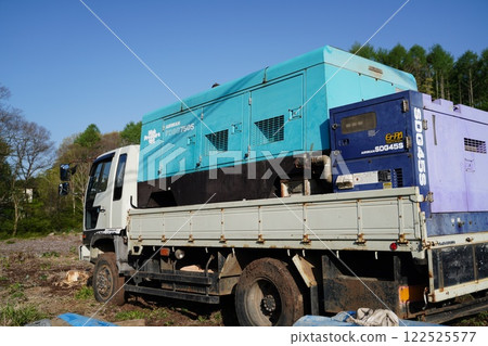 Truck carrying a generator 122525577