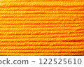 macro picture of orange color thread texture abstract close up fabric background textile surface wallpaper template for banner website backdrop poster 122525610