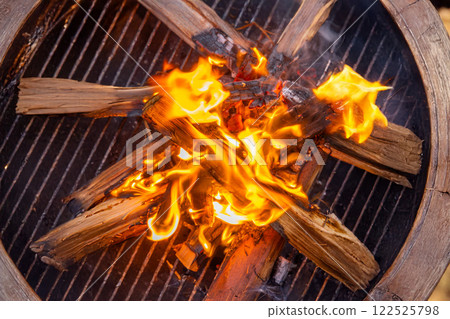 Bonfire Outdoor campfire flames at campsite 122525798