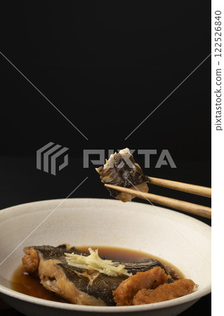 Picking up boiled flounder roe with chopsticks 122526840