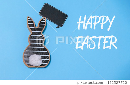 Rabbit is holding a chalkboard with the words Happy Easter written on it Rabbit is holding a chalkboard with the words Happy Easter written on it 122527720