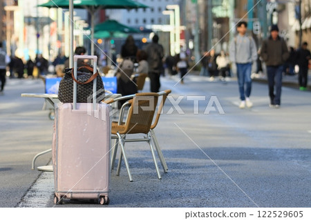 Carry-on bags of foreign visitors placed in the pedestrian precinct in Ginza, a tourist spot in Tokyo 122529605