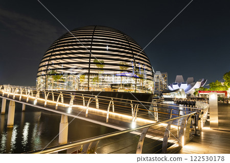 Night view of the Apple Marina Bay Sands with a skyscraper background, Singapore, is the first Apple store in the world surrounded by water. 122530178