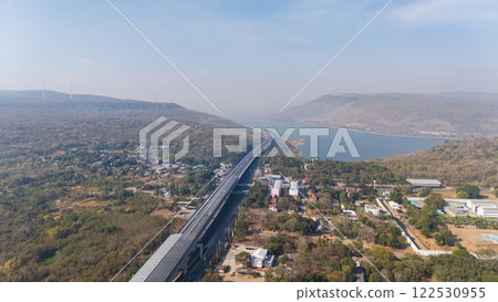 Drone shot aerial view landscape of the M6  motorway Expressway Nakhon Ratchasima Province - Bang Pa-in. Lam Ta Khong River and Mountain. Drone shot of scenic landscape rural place traffic. Nakhon 122530955