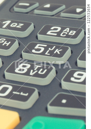 Payment terminal, credit card reader using for cashless paying. Finance concept Payment terminal, credit card reader using for cashless paying. Finance concept 122531634