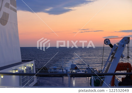 View of the ferry's wake and beautiful morning sky from the exterior deck 122532049