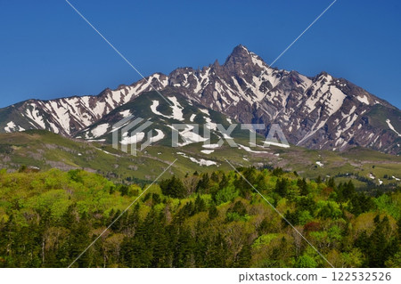 The fresh greenery of Mount Rishiri shines against the blue sky The fresh greenery of Mount Rishiri shines against the blue sky 122532526