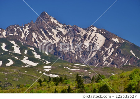 The fresh greenery of Mount Rishiri shines against the blue sky The fresh greenery of Mount Rishiri shines against the blue sky 122532527