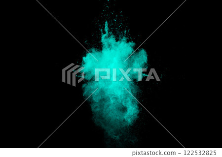 Blue explosion of powdery dust is in the air. The image is dark and moody, with the blue color dominating the scene Blue explosion of powdery dust is in the air. The image is dark and moody, with the blue color dominating the scene 122532825
