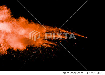 Orange cloud of smoke is floating in the air. The smoke is made up of tiny particles that are suspended in the air. 122532843
