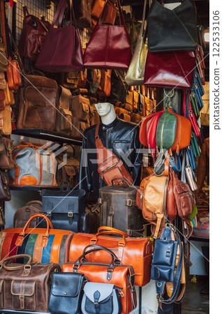 handmade leather bags, belts and accessories on counter in a shop at street market in Hoi An in Vietnam in Asia handmade leather bags, belts and accessories on counter in a shop at street market in Hoi An in Vietnam in Asia 122533106