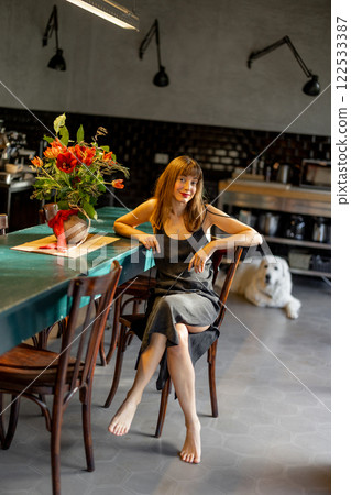 Relaxed Woman in a Modern Kitchen Relaxed Woman in a Modern Kitchen 122533387