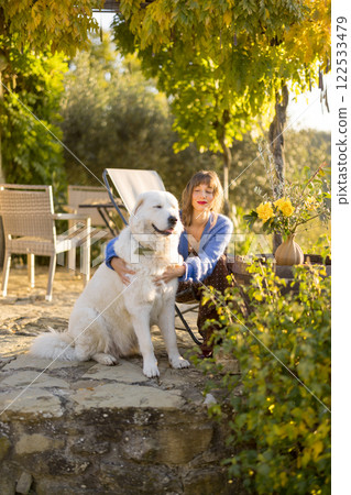 Woman in Rustic Garden Woman in Rustic Garden 122533479