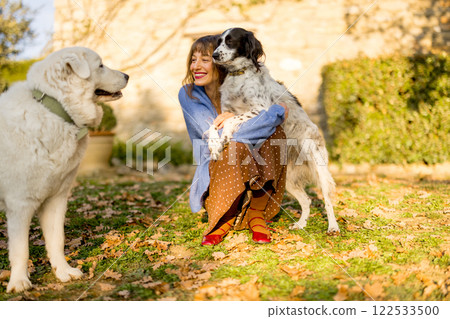 Woman with Dogs in Countryside Woman with Dogs in Countryside 122533500