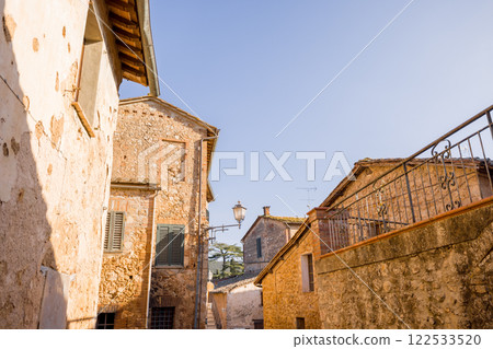 Charming Stone Village Under Clear Blue Sky Charming Stone Village Under Clear Blue Sky 122533520