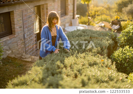 Woman in Rustic Garden Woman in Rustic Garden 122533533