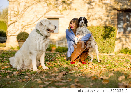 Woman with Dogs in Countryside Woman with Dogs in Countryside 122533541