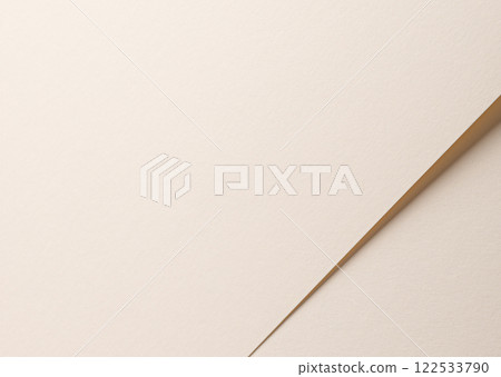 A beige paper background with a soft texture and a gentle gradient, creating a calm and elegant A beige paper background with a soft texture and a gentle gradient, creating a calm and elegant 122533790