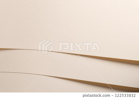 Beige paper background with a smooth, matte texture and a refined, understated elegance. The soft, Beige paper background with a smooth, matte texture and a refined, understated elegance. The soft, 122533832
