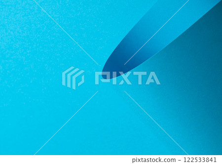 Blue paper background with a smooth matte finish and layered geometric accents. Vibrant pastel tones Blue paper background with a smooth matte finish and layered geometric accents. Vibrant pastel tones 122533841
