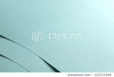 Blue paper texture with a punched, perforated design, featuring soft pastel tones and a matte finish Blue paper texture with a punched, perforated design, featuring soft pastel tones and a matte finish 122533846