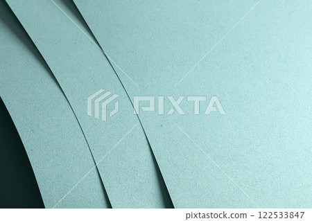 Blue paper texture with a punched, perforated pattern, featuring soft pastel tones and a matte Blue paper texture with a punched, perforated pattern, featuring soft pastel tones and a matte 122533847