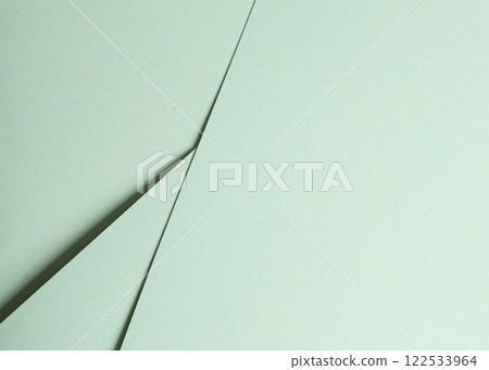 Mint green paper background with a smooth matte surface and soft pastel tones. Clean, refined, and 122533964