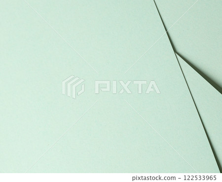 Mint green paper background with a smooth matte surface and soft pastel tones. Delicate and tranquil 122533965