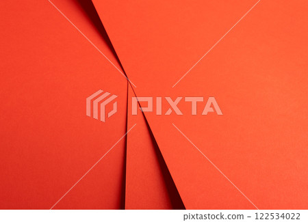 Red and orange paper background with a matte finish and sharp, layered angles. Warm, vibrant tones Red and orange paper background with a matte finish and sharp, layered angles. Warm, vibrant tones 122534022