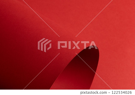 Red paper background with a matte texture and soft tones. Bold ruby and crimson hues create a Red paper background with a matte texture and soft tones. Bold ruby and crimson hues create a 122534026