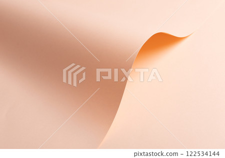 Soft pink and peach paper background with a stylish and refined texture. Featuring a subtle satin 122534144