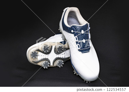 Golf shoes have soft spikes that provide a strong grip. [Image of golf equipment] 122534557