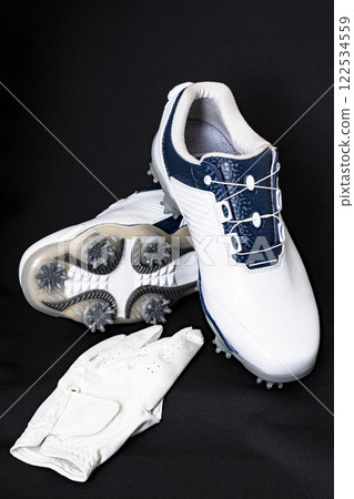 Golf shoes have soft spikes that provide a strong grip. [Image of golf equipment] 122534559