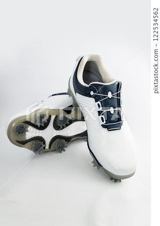 Golf shoes have soft spikes that provide a strong grip. [Image of golf equipment] 122534562