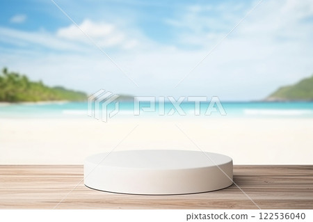 A white circular pedestal is placed on a weathered wooden table, framed by the tranquil vista of a sandy beach, a blue ocean, and a light blue sky. Created with generative AI tools 122536040