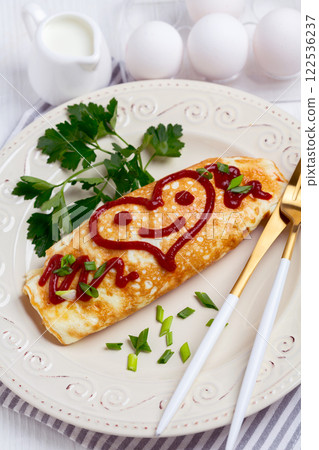 Omuraisu omelet with a smiley heart. 122536237