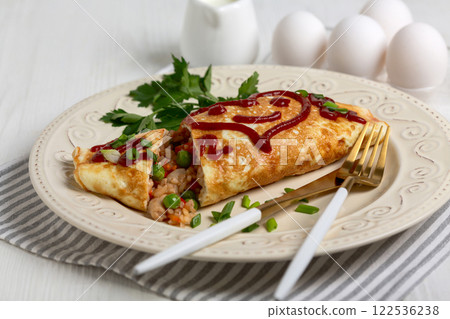 Omelet with chicken, rice and vegetables. Omelet with chicken, rice and vegetables. 122536238