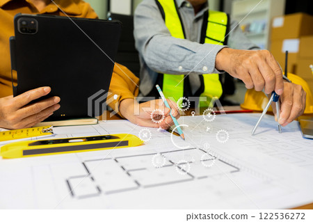 Engineer teams meeting working together wear worker helmets hardhat on construction site in modern city Engineer teams meeting working together wear worker helmets hardhat on construction site in modern city 122536272