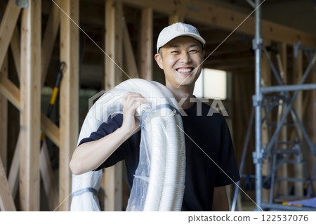 man working at construction site 122537076