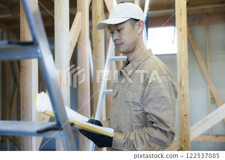 man working at construction site man working at construction site 122537085