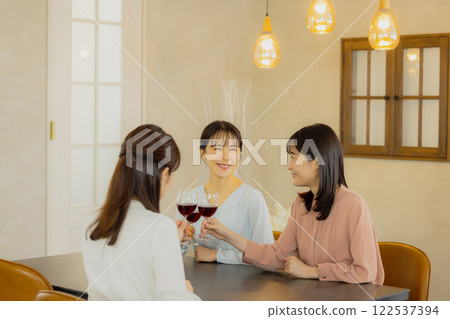 Woman holding a glass of alcohol 122537394