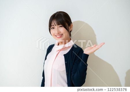 A Japanese female staff member giving a tour 122538376