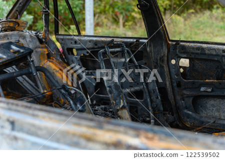 Burnt-out interior of a passenger car. Burnt-out interior of a passenger car. 122539502
