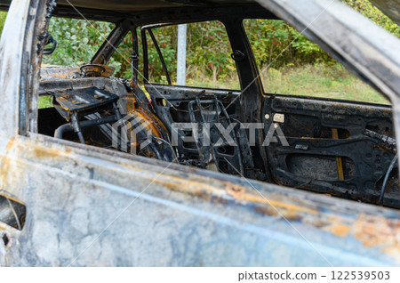 Burnt-out interior of a passenger car. Burnt-out interior of a passenger car. 122539503