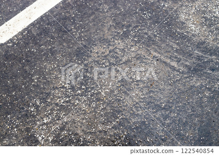 marble and granite chips on surface of road marble and granite chips on surface of road 122540854
