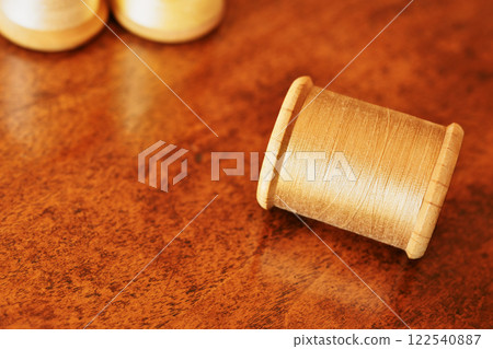 Spool with yellow thread 122540887