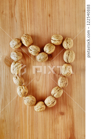 Heart shaped with fruit of walnuts Heart shaped with fruit of walnuts 122540888