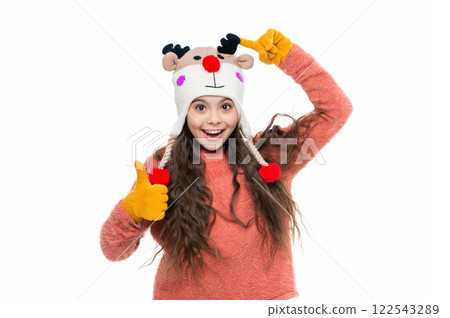 Winter fashion style. Girl in knitwear. Portrait of teen child wearing warm winter clothes. Girl kid wear warm hat isolated on white. Happy childhood. Teen girl in earflap hat. Winter wardrobe 122543289